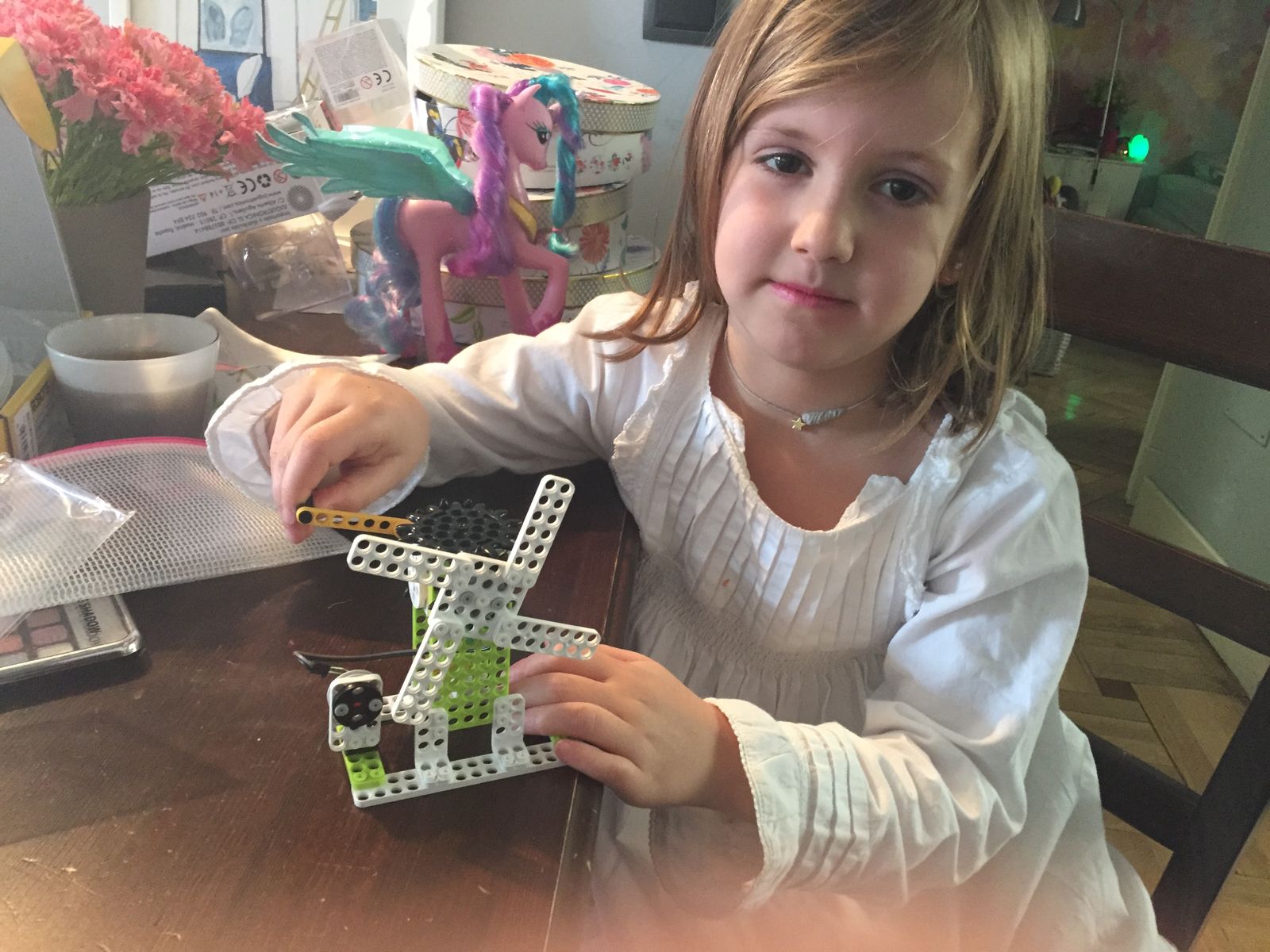 With the windmill I built, turning the crank