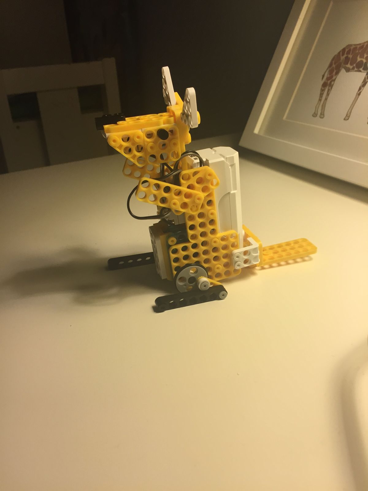 A yellow robot kangaroo on the table